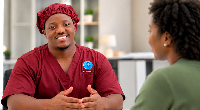Dr. Newton Allan speaking with a patient